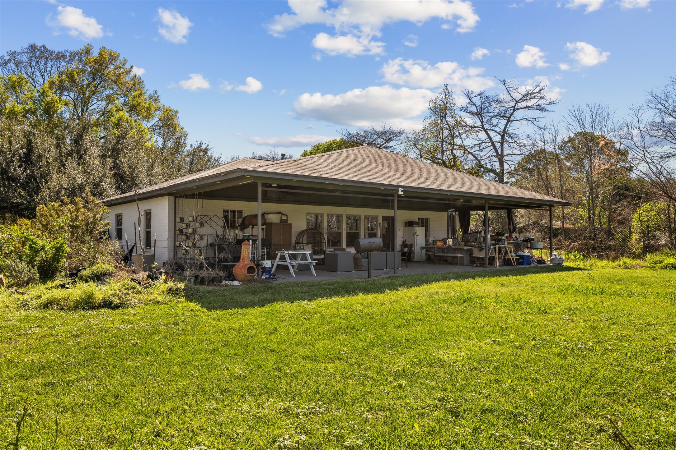 4425 Fuqua Street Houston, TX 77047 - Photo 32 of 49 a view of a house with swimming pool and sitting area