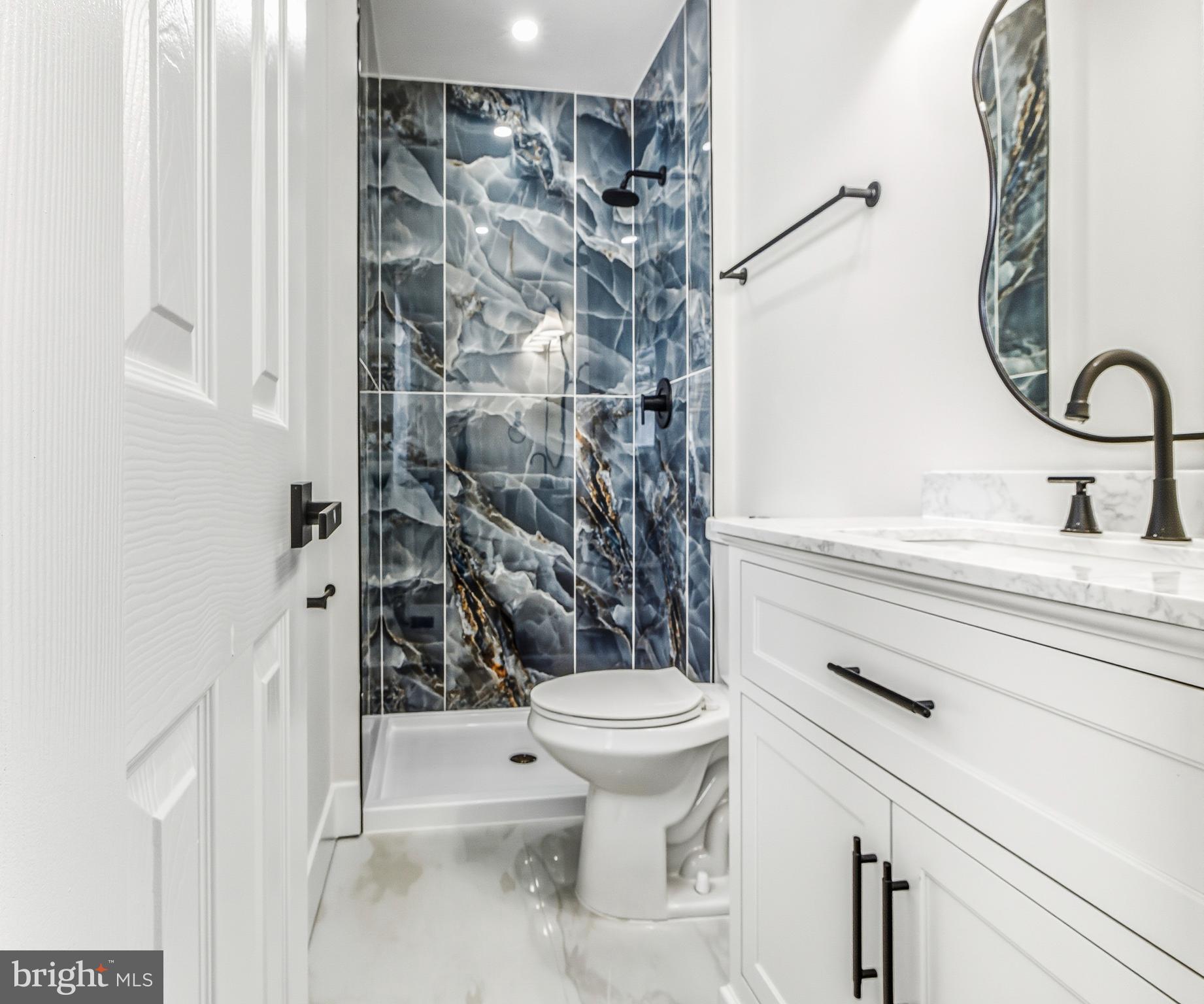 28 Country Club Road Willingboro, NJ 08046 - Photo 18 of 20 a bathroom with a sink a toilet and shower