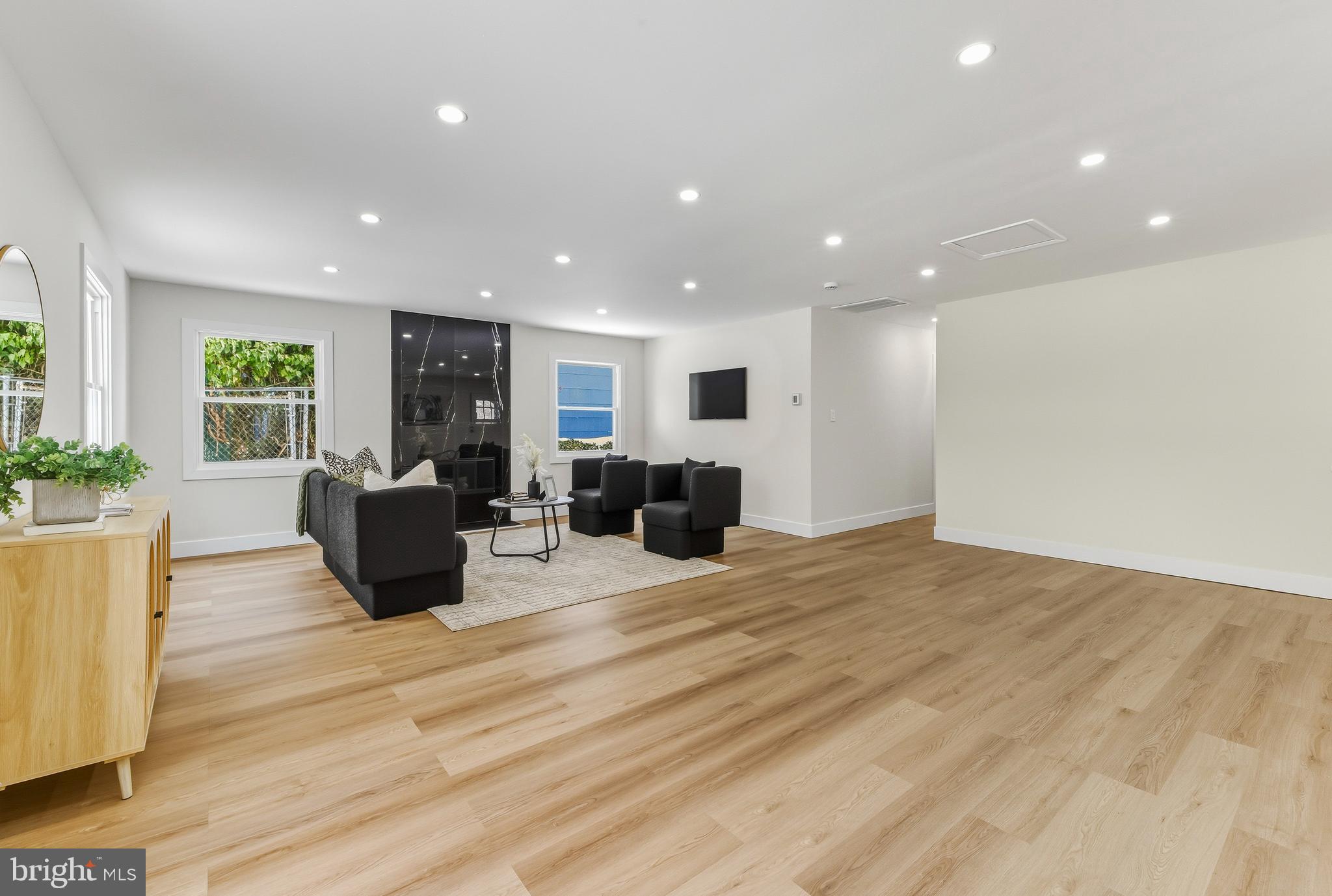 28 Country Club Road Willingboro, NJ 08046 - Photo 4 of 20 a large room with furniture a potted plant and wooden floor