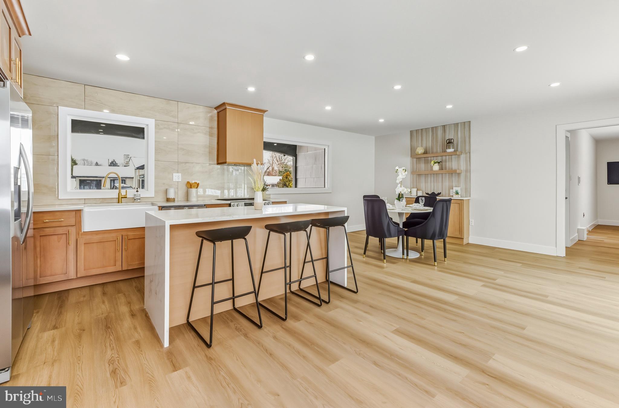 28 Country Club Road Willingboro, NJ 08046 - Photo 8 of 20 a kitchen with stainless steel appliances kitchen island granite countertop a stove a sink a dining table and chairs
