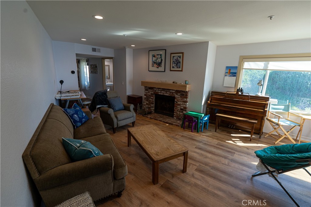 258 West Escalones, Unit 6R San Clemente, CA 92672 - Photo 14 of 22 a living room with furniture and a fireplace