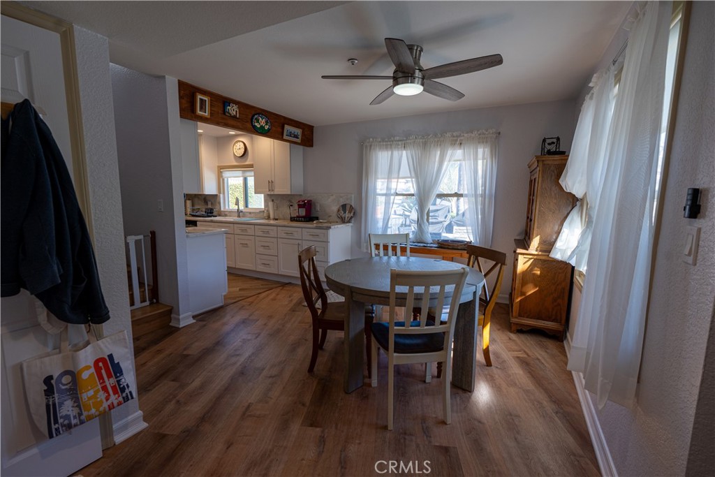 258 West Escalones, Unit 6R San Clemente, CA 92672 - Photo 15 of 22 a view of a dining room with furniture window and wooden floor