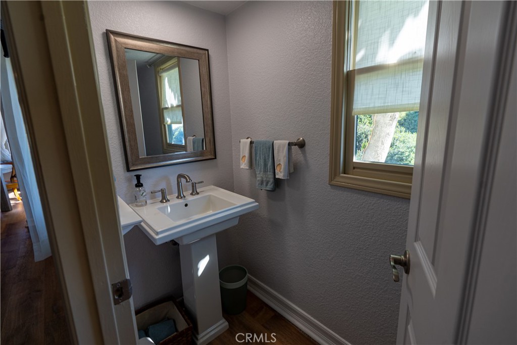 258 West Escalones, Unit 6R San Clemente, CA 92672 - Photo 16 of 22 a bathroom with a sink a toilet and mirror