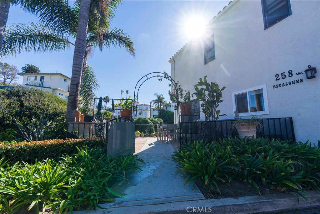258 West Escalones, Unit 6R San Clemente, CA 92672 - Photo 2 of 22 a front view of a house with garden and plants