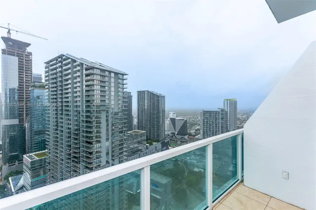 a view of a chairs and table in patio