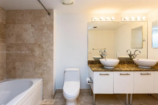 a view of a city with tall buildings