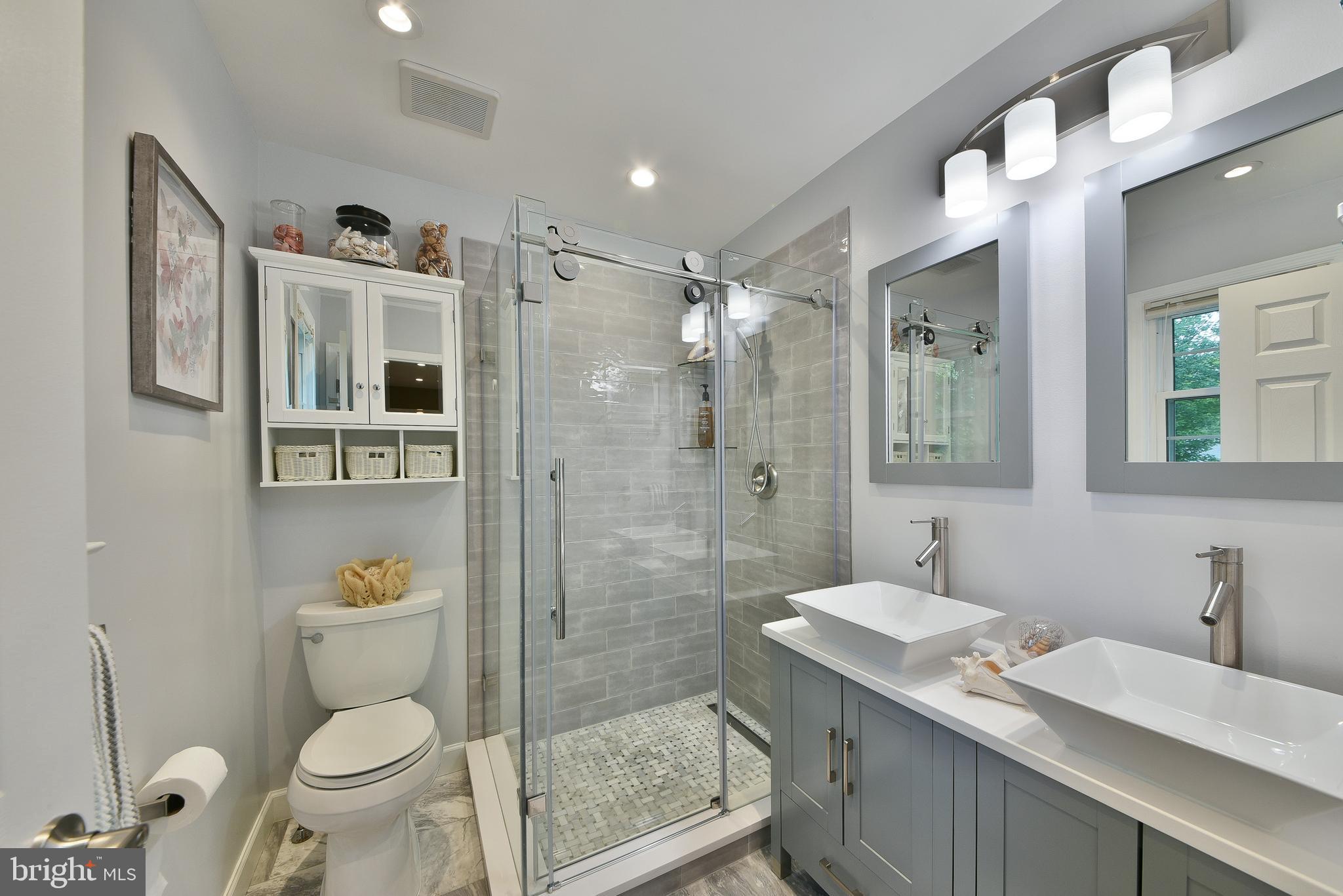 192 Bull Run Road Ewing, NJ 08638 - Photo 19 of 46 a bathroom with a sink a toilet and shower