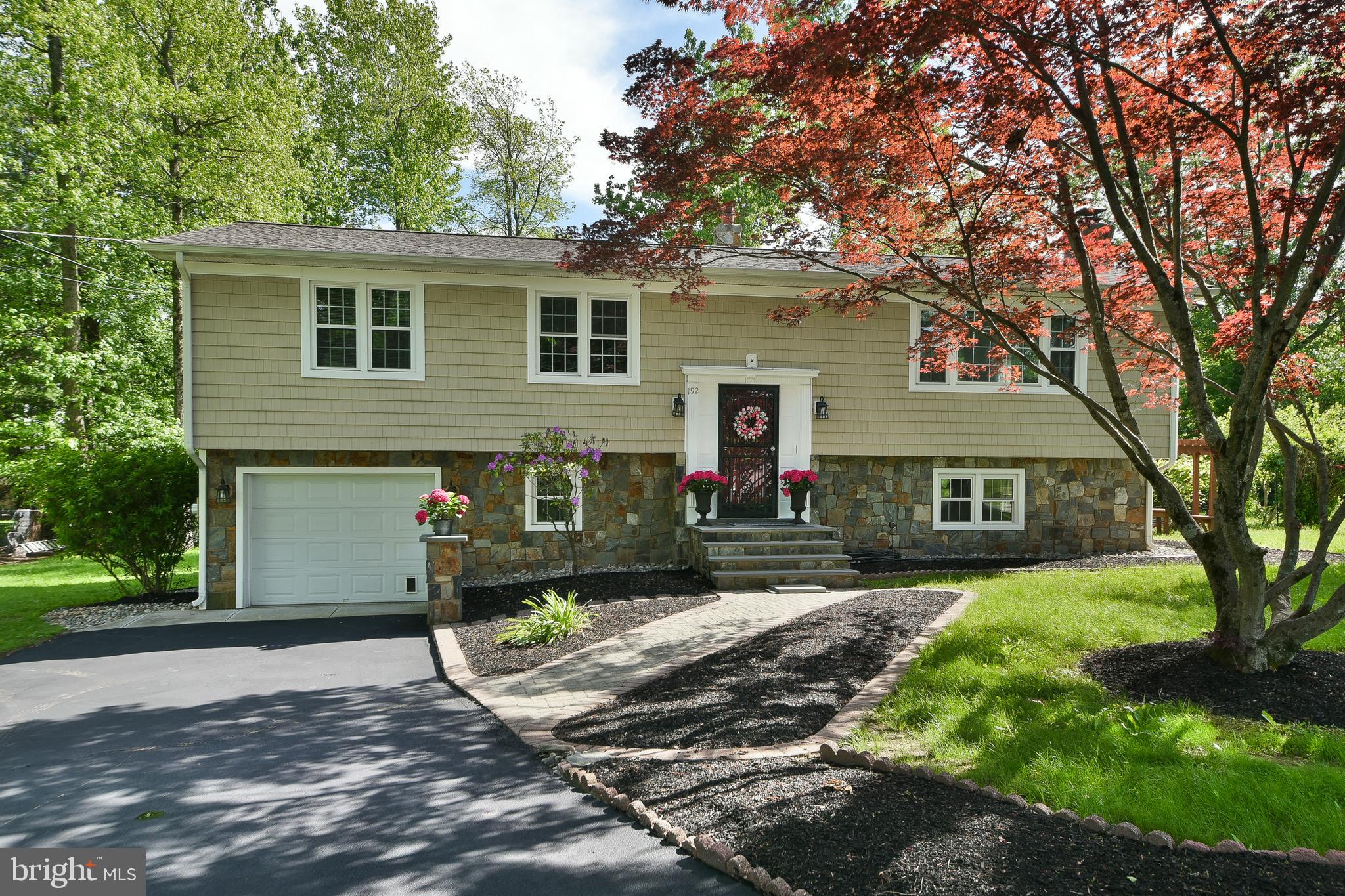 192 Bull Run Road Ewing, NJ 08638 - Photo 2 of 46 a front view of a house with a yard and garage