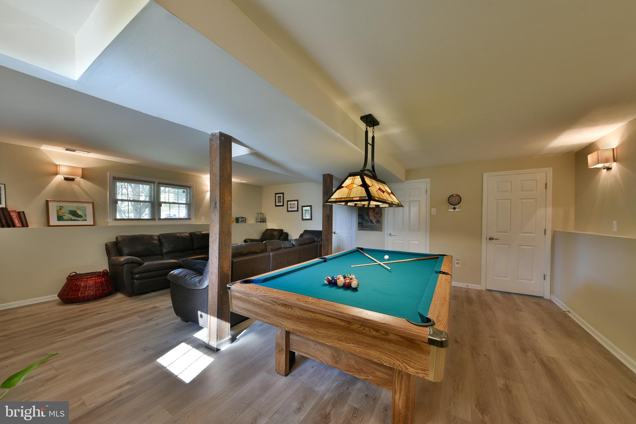 192 Bull Run Road Ewing, NJ 08638 - Photo 29 of 46 a living room with furniture pool table wooden floor and windows