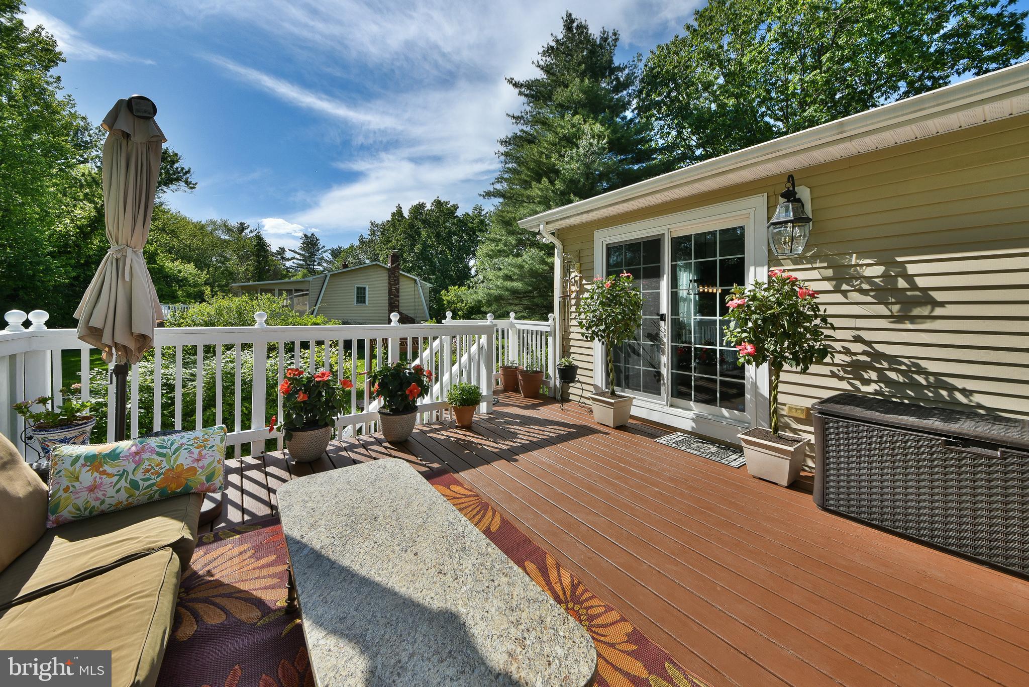 192 Bull Run Road Ewing, NJ 08638 - Photo 35 of 46 a view of a deck with couches table and chairs and wooden floor