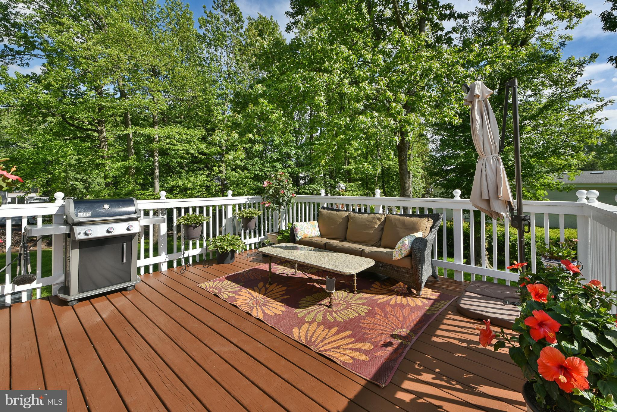 192 Bull Run Road Ewing, NJ 08638 - Photo 36 of 46 a view of a deck with chairs a barbeque with wooden floor and fence