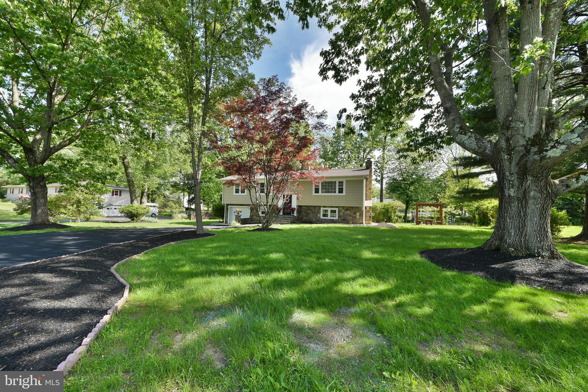 192 Bull Run Road Ewing, NJ 08638 - Photo 4 of 46 a view of a yard with plants and trees