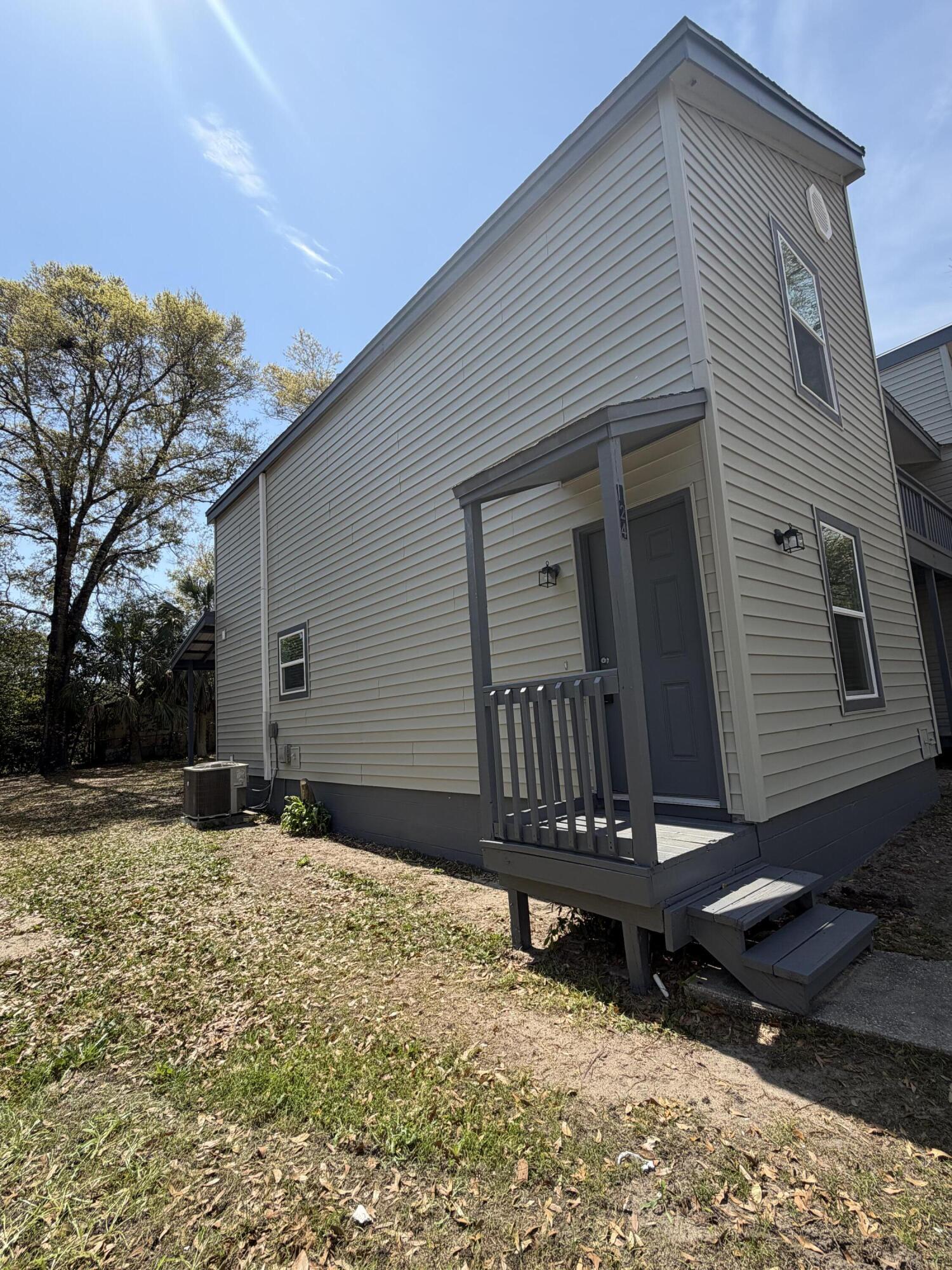 a backyard of a house with table and chairs