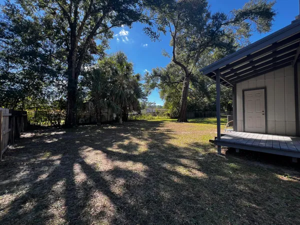 a view of swimming pool with outdoor seating and yard
