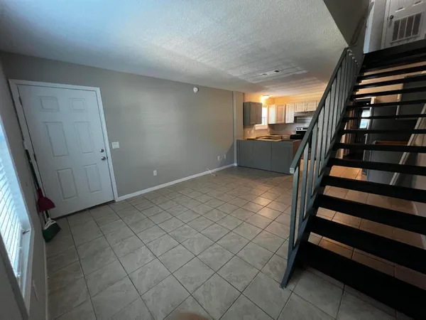 a view of entryway with stairs and a window