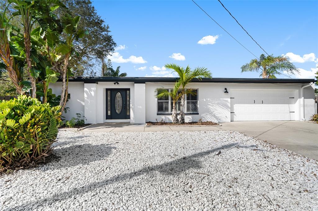 a backyard of a house with lots of green space
