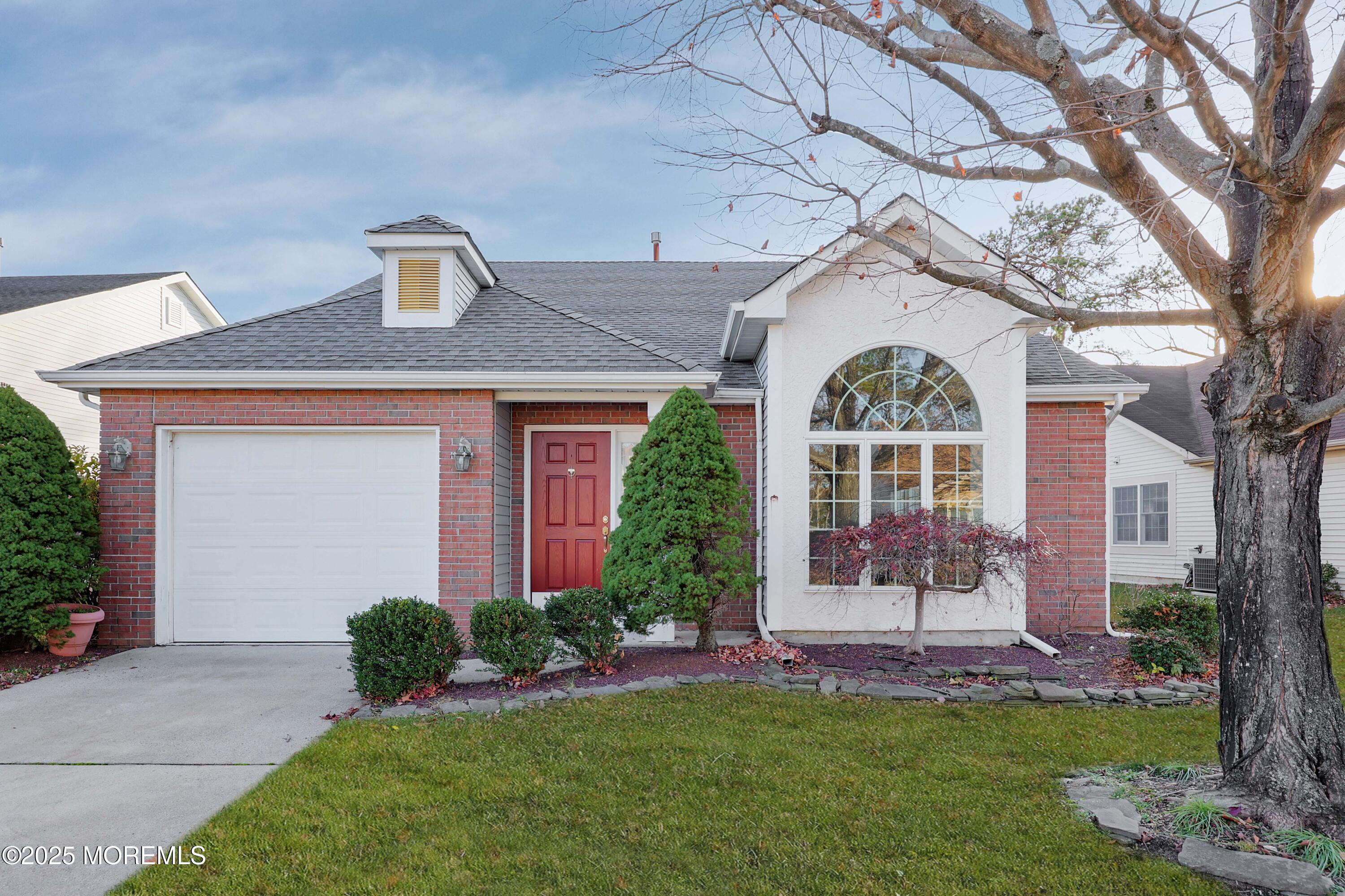 a front view of a house with a yard