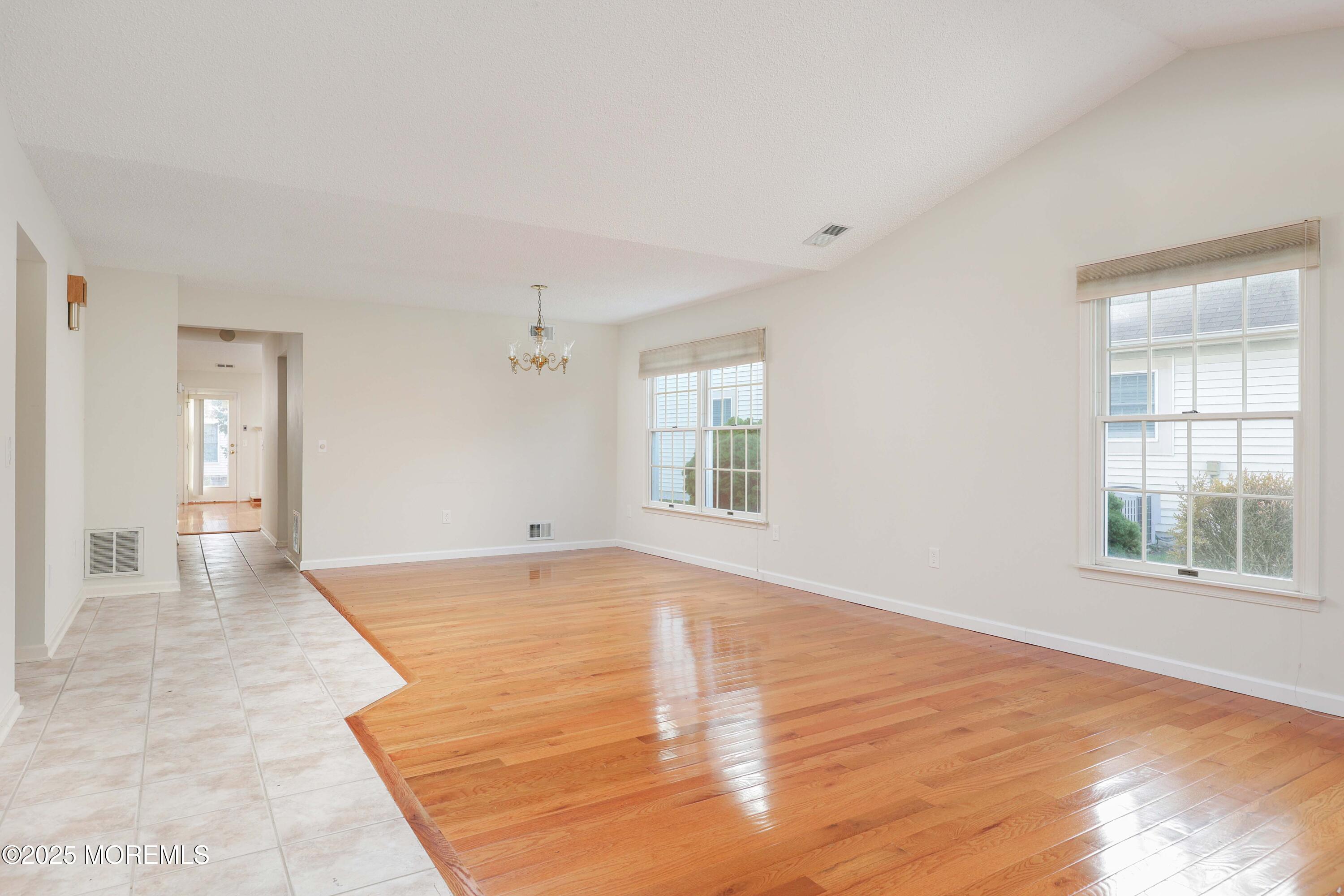 1665 Goldspire Road Toms River, NJ 08755 - Photo 17 of 37 wooden floor in an empty room with a window