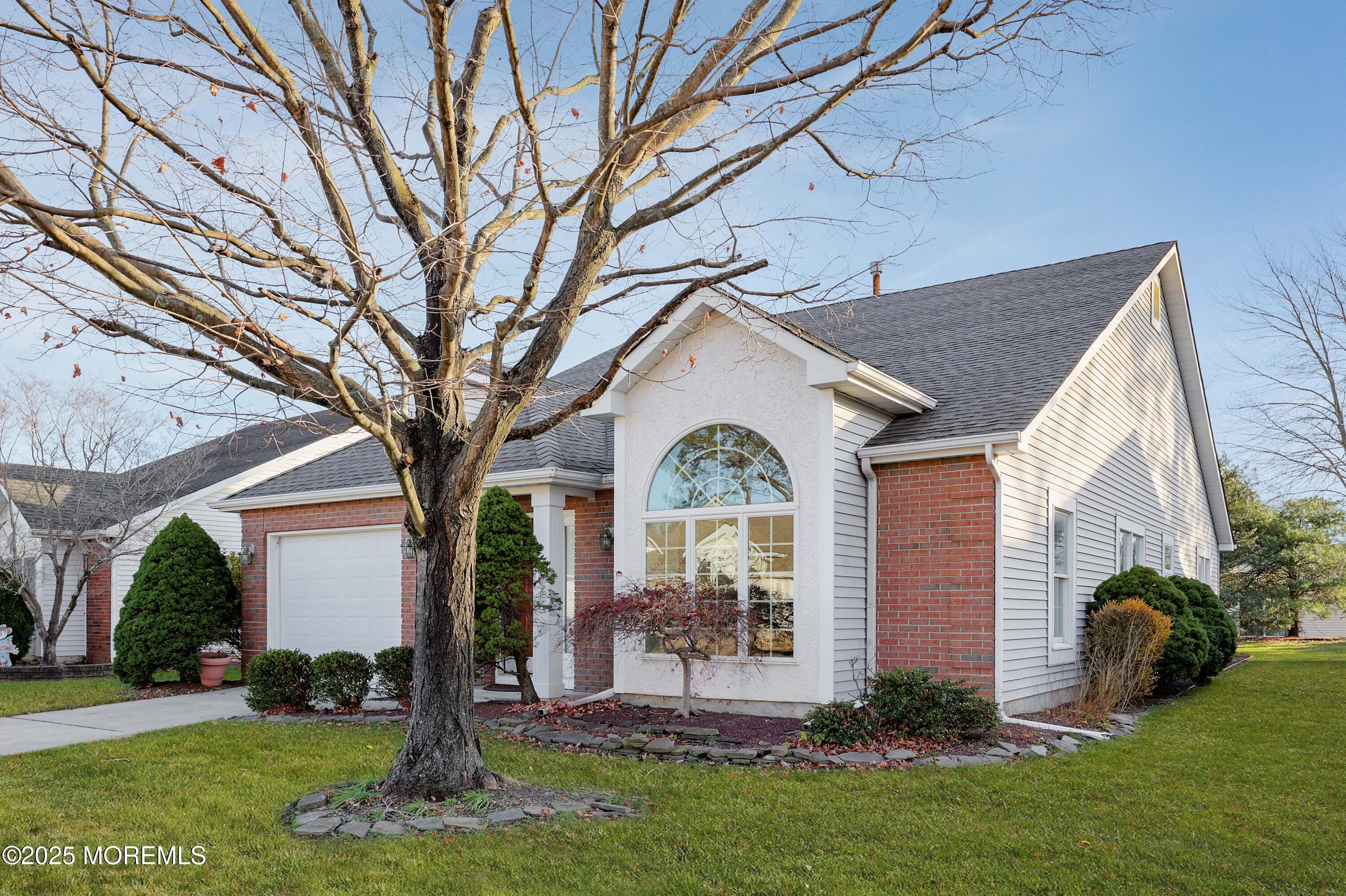 1665 Goldspire Road Toms River, NJ 08755 - Photo 2 of 37 a front view of a house with a yard