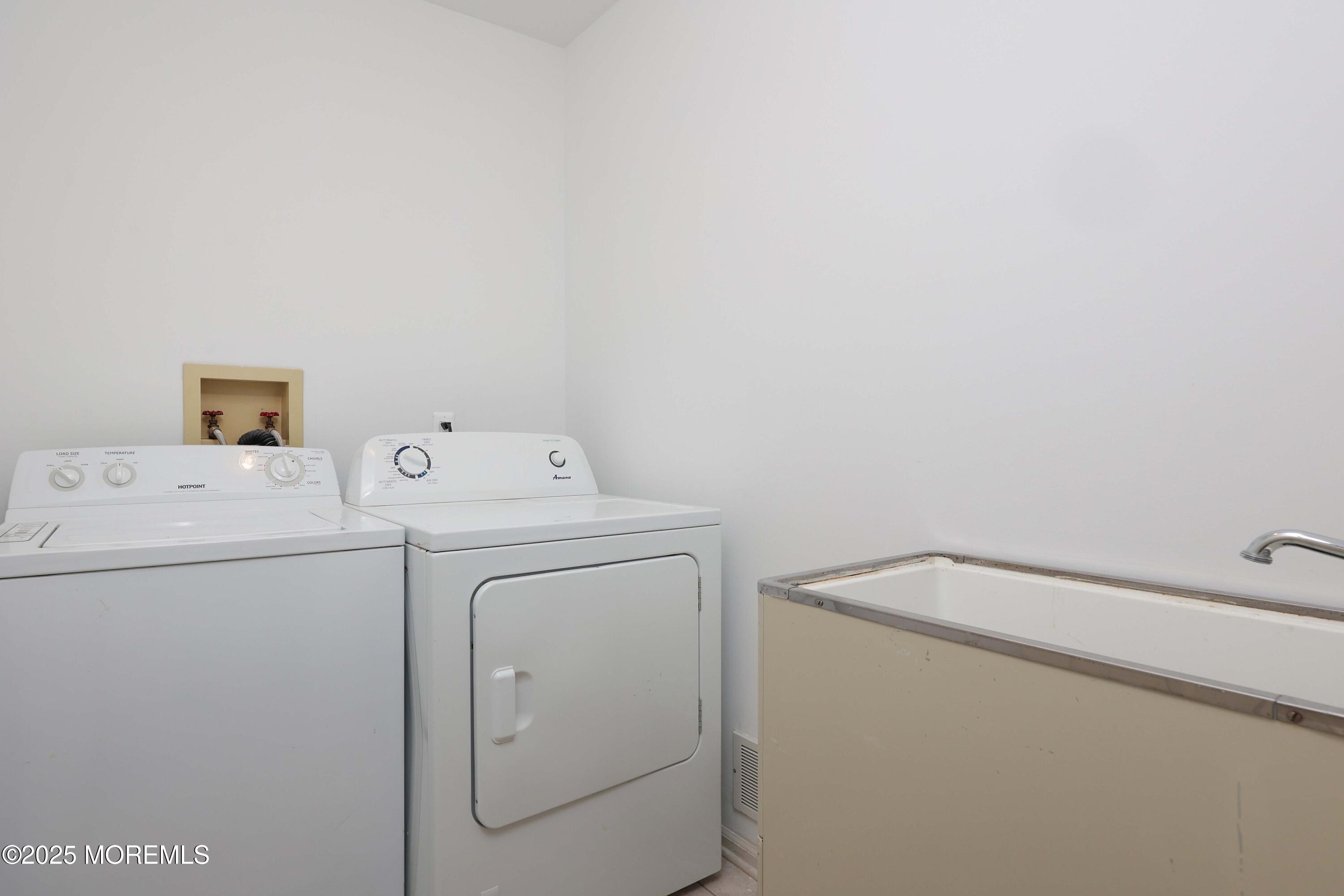 1665 Goldspire Road Toms River, NJ 08755 - Photo 35 of 37 a utility room with dryer and washer