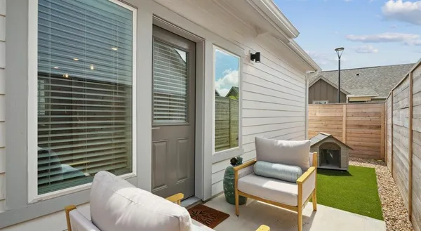 a view of a patio with couches chairs and potted plants
