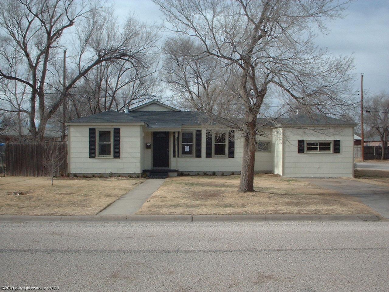 4200 South Tyler Street Amarillo, TX 79110 - Photo 1 of 8 a house that has a tree in front of it