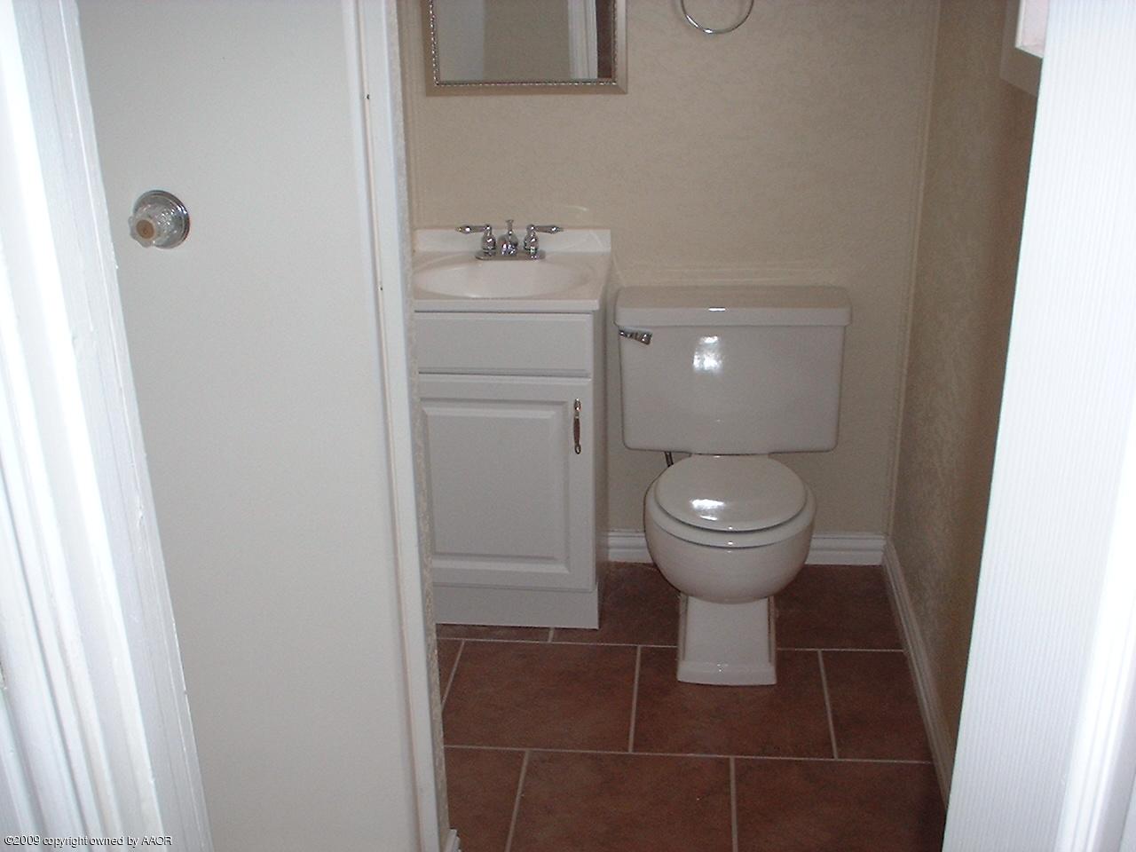4200 South Tyler Street Amarillo, TX 79110 - Photo 5 of 8 a bathroom with a toilet and a sink