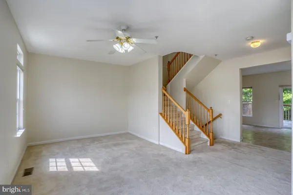 a kitchen with a refrigerator sink stove and cabinets