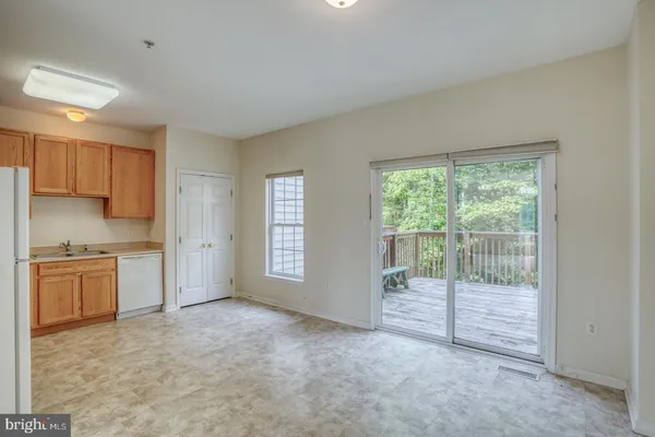 a balcony with wooden floor and fence