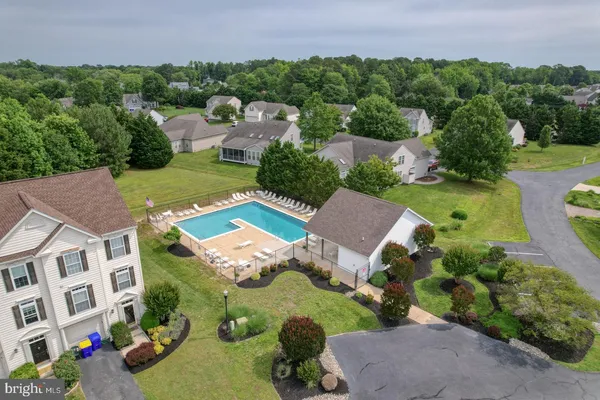 an aerial view of a house with a swimming pool