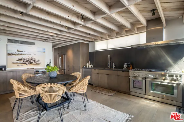 a view of a kitchen and dining room