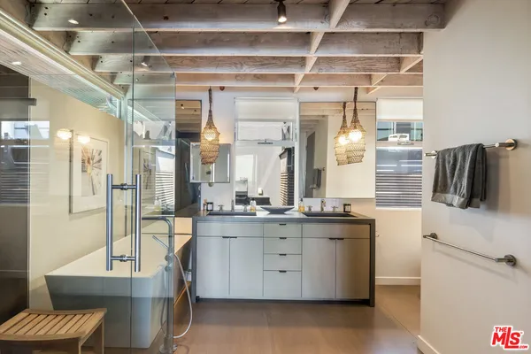 a kitchen with a sink and refrigerator
