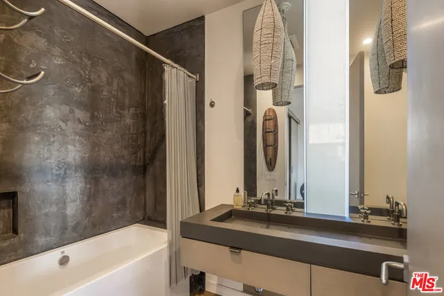 a bathroom with a bathtub and a sink