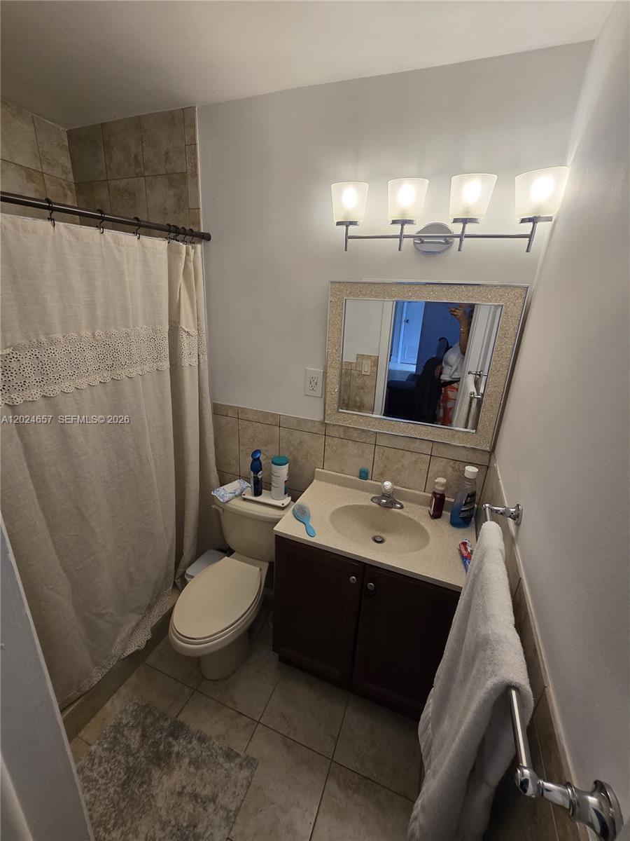 3619 West Park Road Hollywood, FL 33021 - Photo 14 of 19 a bathroom with a sink toilet and shower