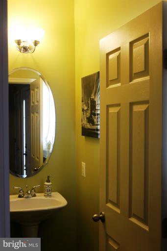 707 MacDill Road Baltimore, MD 21220 - Photo 14 of 20 a bathroom with a sink and a mirror