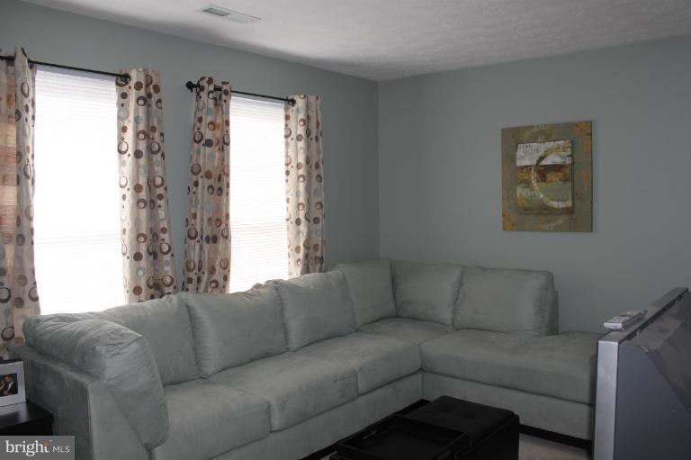 707 MacDill Road Baltimore, MD 21220 - Photo 3 of 20 a living room with furniture and a window