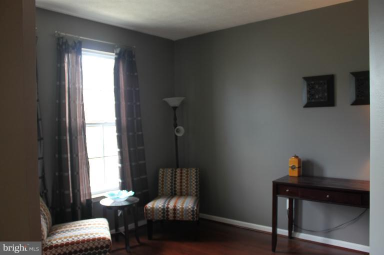 707 MacDill Road Baltimore, MD 21220 - Photo 4 of 20 a living room with furniture and a window
