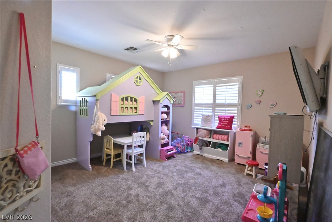 2729 Kildrummie Street Henderson, NV 89044 - Photo 32 of 42 A vibrant play area boasts carpeted flooring and ample natural illumination from window treatments.