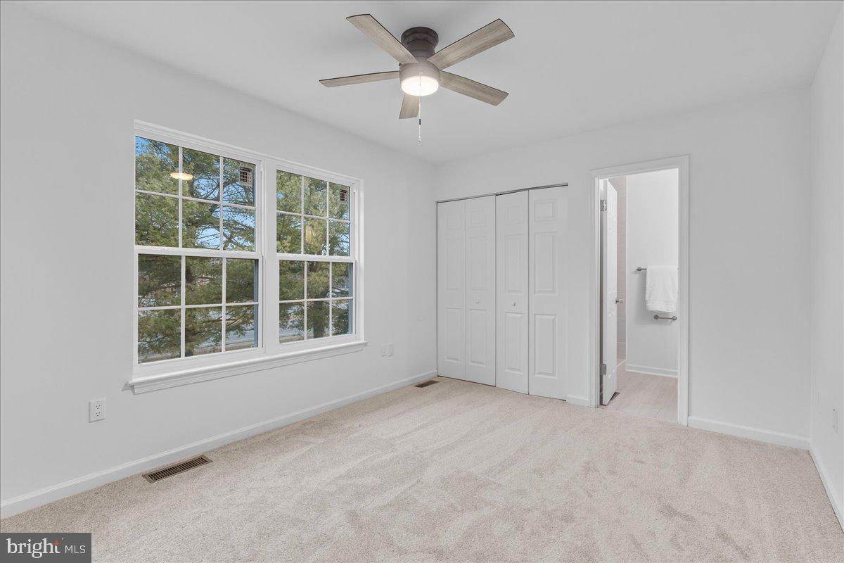 2227 Rock Creek Road Fredericksburg, VA 22407 - Photo 19 of 31 an empty room with a window and a ceiling fan
