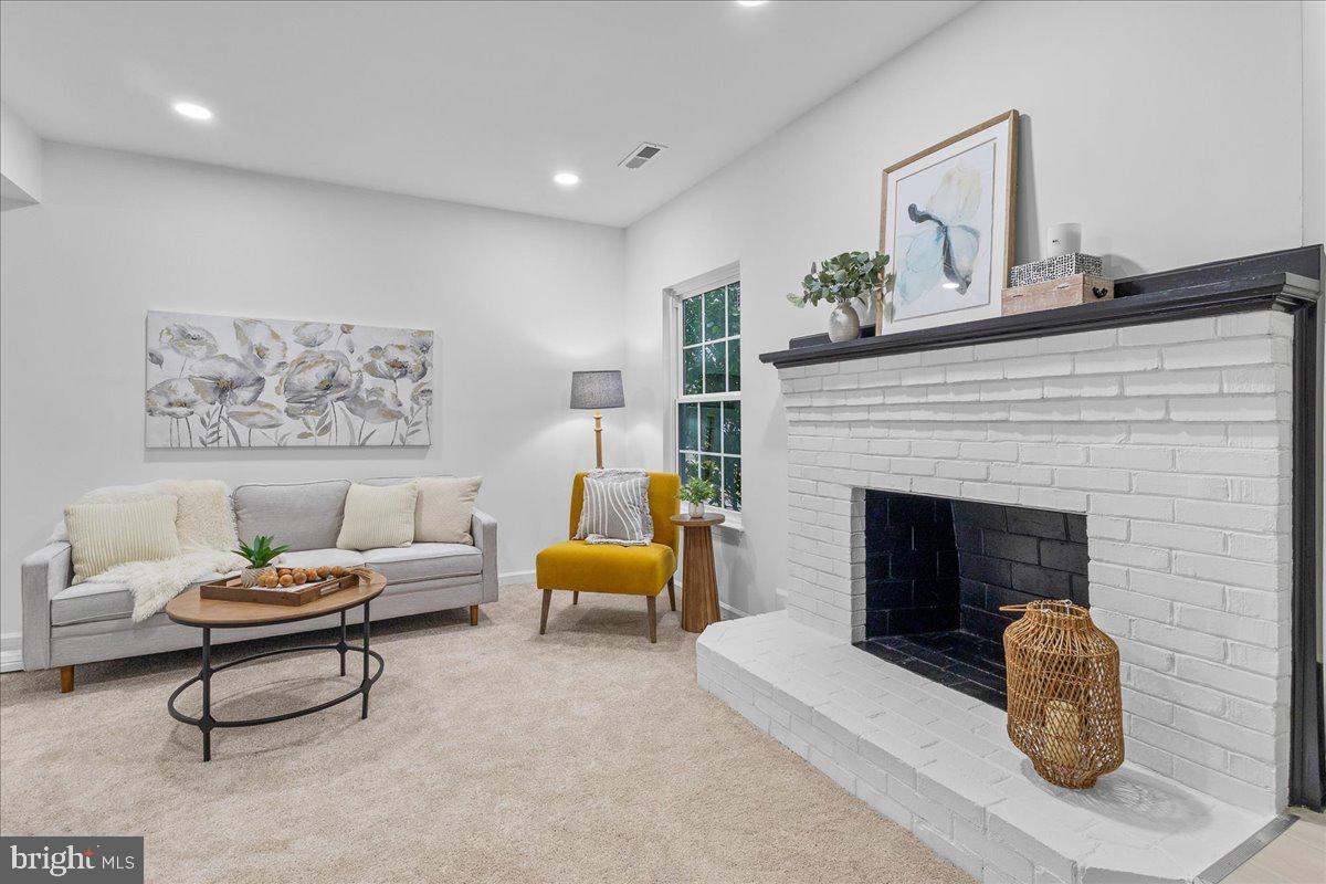 2227 Rock Creek Road Fredericksburg, VA 22407 - Photo 6 of 31 a living room with furniture and a fireplace