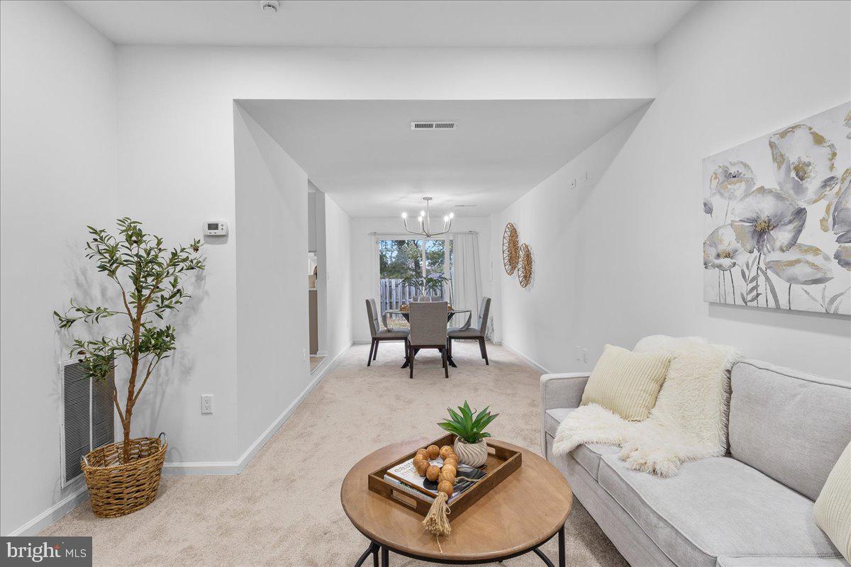 2227 Rock Creek Road Fredericksburg, VA 22407 - Photo 7 of 31 a living room with furniture potted plant and a table