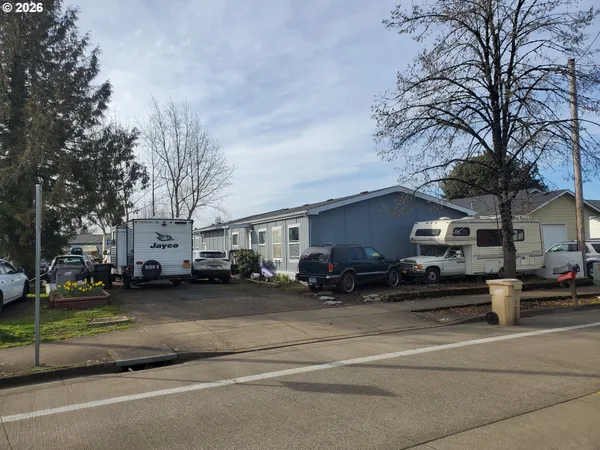 a street view with a barbeque and trees
