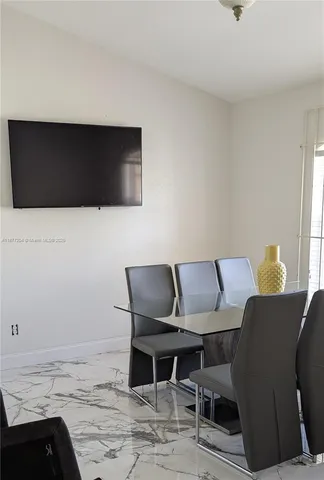 a living room with a couch and a flat screen tv