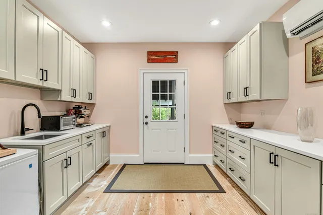 a kitchen with stainless steel appliances granite countertop a sink and cabinets
