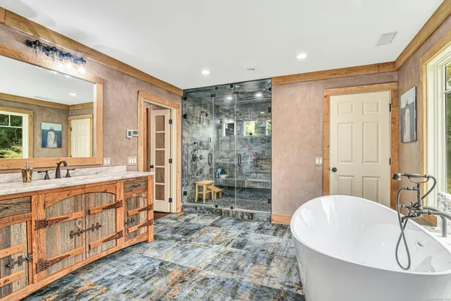 a bathroom with a double vanity sink and a mirror