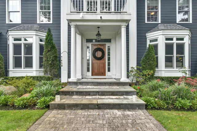 a front view of a house with garden
