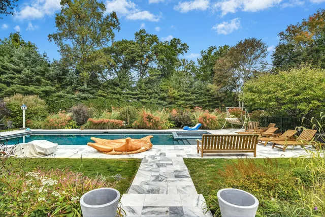 a view of a swimming pool with a patio