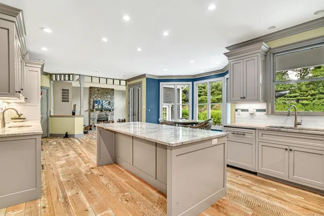 a kitchen with a sink stove and cabinets