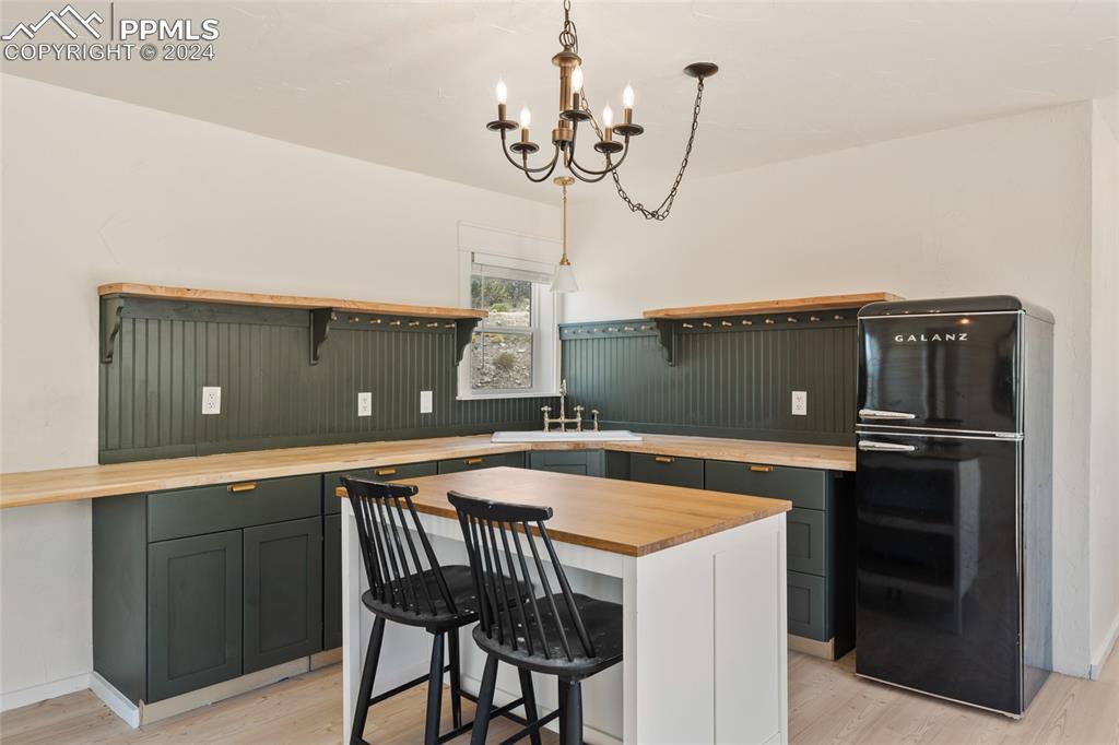 659 Turrell Trail Penrose, CO 81240 - Photo 6 of 19 a kitchen with a table and chairs