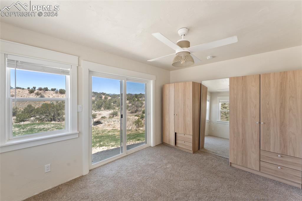 659 Turrell Trail Penrose, CO 81240 - Photo 9 of 19 a view of a livingroom with a ceiling fan and window